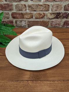 Handmade Panama Hat and Removeable ~ Grey ~ Accessory Band  The band is interchangeable and can be removed to reveal a plain dark band underneath (dark band fixed to hat). The removeable band is elasticated and will stretch for different size hats.  ~ Genuine Panama hat handwoven with Toquilla palm ~ ~ Handwoven in Ecuador ~ ~ White Panama ~ ~ Possible to roll for easy travel ~ ~ Inside comfort band ~ Other colour Panama hats and bands available from our store > https://www.etsy.com/shop/persona White Wide Brim Rigid Hat, White Rigid Flat Brim Hat, White Flat Brim Hat With Rigid Fit, Classic White Adjustable Straw Hat, White Adjustable Classic Straw Hat, Classic White Adjustable Fedora, Classic White Adjustable Hat, Classic Adjustable White Hat, White Classic Rigid Hat Band