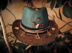 **FREE SHIPPING** One-Off, Custom/ Handpainted Fedora Hat. handpainted & decorated in a boho style. There is  a brown cord with tussels & dried leaves decorating the hat. 100% Paper Straw SIZE: 58-59cm *The number is the perimeter of the head expressed in centimeters (cm). To find your number (size), take a measuring tape and measure the perimeter of the head. The tape measure should be placed in the middle of the forehead and just above the ears (about 0.5 cm, above the ears). Hold the tape measure firmly, but not too tightly (Hats are not supposed to be very tight). The centimeters that you will see in the measuring tape, is also the number of the hat. (There is an example of how to measure your head in the photos). *Ready to ship Please, feel free to message me any questions you may hav Bohemian Handmade Fedora With Curved Brim, Handmade Bohemian Fedora With Curved Brim, Bohemian Hand Painted Sun Hat For Festivals, Bohemian Hand Painted Hats For Vacation, Bohemian Hand Painted Straw Hat For Vacation, Bohemian Sun Hat With Hand Painted Short Brim, Bohemian Hand-painted Straw Hat For Spring, Bohemian Hand Painted Straw Hat For Spring, Bohemian Hand Painted Sun Hat For The Beach