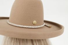 In coordination with Gigi Pip's first collaboration hat with Cara Loren, we're excited to introduce the Cara Loren braided leather hat band. To compliment Cara's neutral loving style, we created a white, thick braided rope band with genuine leather + gold hardware. This hat band is a one size fits all band that is adjustable. Pull the tails of the band to tighten once the band is around the crown of your hat. Shop The Cara Loren hat in Off White and Tan. Shop the Cara Loren Bolo Hat Band for a d Affordable Trendy Clothes, Cara Loren, Gigi Pip, Pencil Roll, Rancher Hat, Fedora Hat Women, Leather Hat, All Band, Halo Style