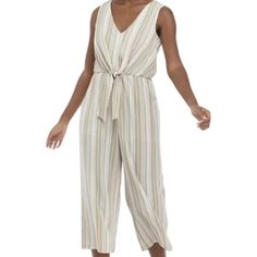 Crop Jumpsuit Sized Medium With A Wide-Legged And A Tie In Front. Has Elsatic Waistband With Button Closure On Neck. Has A V-Neck And Sleeveles. 49 In Length 21 In Inseam Material Is Polyester And Spandex Modern Jumpsuit, Unique Ties, Women's Tie, Cropped Jumpsuit, Womens Tie, Pant Jumpsuit, Jumpsuit Romper, Pants For Women, Jumpsuit