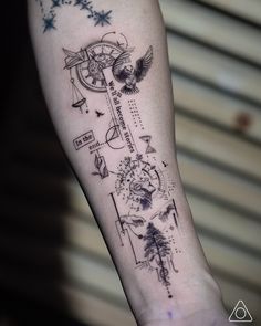 a person with a tattoo on their arm that has a clock and stars around it