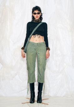 These Y2K vintage trousers are a sporty coquette dream come true with their low waist and cargo style. We overdyed them to get this nice moss green colour. Recommended size: EU 36-38 Features: - eight pockets - zip closure - reworked Every item we manage is cleaned and, when necessary, repaired, ensuring it arrives to you in top condition. Our model, Noemi is 177 cm / 69.0" tall and she's a size S. Size: S / US 4 / UK 8 / IT 40 Measurements:  waist (seam to seam): 40 cm / 15.6" rise: 21 cm / 8.2" inseam length: 55 cm / 21.5" Care: Machine wash separately Cargo Capris Outfit Y2k, Y2k Mid-rise Cargo Pants, Y2k Cotton Cargo Bottoms, Y2k Cotton Cargo Pants, Vintage Cargo Trousers, Sporty Coquette, Capri Cargo Pants, Cargo Hose, Vintage Trousers