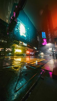 a city street at night in the rain