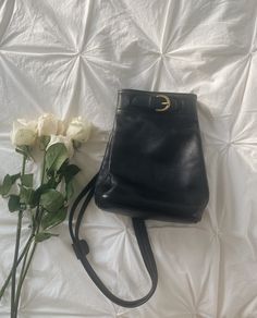 Stunning vintage 1990's black Coach leather backpack, made in USA quality. Such a classic petite backpack and favorite designer find. Featuring solid brass accents and most supple leather. Measures 7in x 4.25in x 9.5in. In stunning vintage condition with very minor vintage wear. Corners and interior are in beautiful condition. Has been freshly cleaned and conditioned. Classic Satchel Backpack With Gold-tone Hardware, Classic Leather Backpack With Gold-tone Hardware, Classic Leather Satchel Backpack With Gold-tone Hardware, Classic Leather Backpack With Gold-tone Hardware For Daily Use, Classic Everyday Backpack With Gold-tone Hardware, Classic Leather Backpack For Formal Occasion, Vintage Black Leather Backpack For Daily Use, Black Vintage Leather Backpack For Daily Use, Elegant Formal Backpack With Gold-tone Hardware