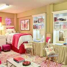 a bedroom decorated in pink and white with lots of accessories on the bed, desks, and chairs