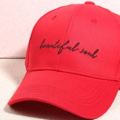 a red baseball cap with the word franklin written on it