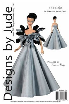 a paper doll wearing a silver dress with black bows on the waist and shoulder,