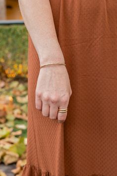 The Woven Gold and Silver Bangle Cuff Bracelet is the perfect bracelet if you love mixed metals. It is made of sterling silver and gold filled wires twisted together to make a stunning addition to your stack. (CHECK SIZING INSTRUCTIONS BELOW) *Non engraved orders may take up to 2-4 business days before shipping. Orders, including engraved jewelry items may take up to 3-5 business days. MOST COMMONLY ASKED QUESTIONS 1. What material is this bangle made of? .940 Argentium Sterling Silver, and 14K Dainty Stackable Gold Cuff Bracelet, Gold Sterling Silver Stackable Bangle Bracelet, Dainty Stackable Cuff Bangle Bracelet, Dainty Gold Stackable Cuff Bracelet, Dainty Adjustable Stackable Cuff Bracelet, Gold Twisted Stackable Jewelry, Gold-toned Sterling Silver Bangle For Everyday, Gold-toned Sterling Silver Fine Jewelry Bangle, Classic Tarnish-resistant Gold Brass Bracelet