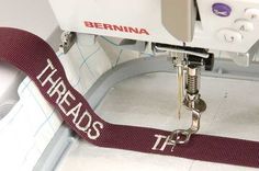 a sewing machine with the words treads on it