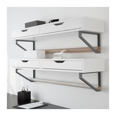 two white shelves with black metal brackets on them