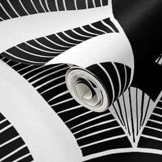 a black and white wallpaper with an abstract design on the bottom half of it