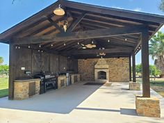 an outdoor bbq with grills and seating