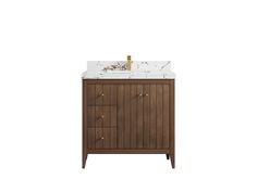 a bathroom vanity with a marble top and wooden cabinetry on one side, two gold faucets on the other