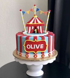 a circus themed birthday cake on a table