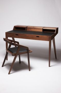 a desk and chair are shown in this advertisement