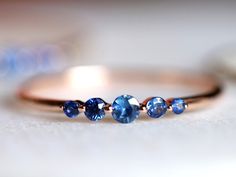 Blue sapphire ring, Blue sapphire stacking ring, dainty ring, stacking ring, stackable ring, blue sapphire ring, Sapphire ringAvailable in 9k/14k/18k yellow, rose or white gold.Same design can be made also with other custom gemstones per request. Product details:- Solid gold- approx 2.5, 2, 1.5 mm sapphire round- Band size is 1.2mm- Made to order - 8 to 10 business days.Ring size - US 3 to US 9 (for smaller or larger ring size, please contact)Please select your size at the drop down menu. Servic Micro Pave Wedding Band, Gold Blue Sapphire Ring, Birthstone Band, Silver Bridal Jewellery, Blue Sapphire Jewelry, Ring Blue Sapphire, Dainty Diamond Ring, Make Rings, Sapphire Diamond Engagement