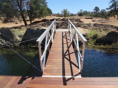 a wooden bridge over a body of water