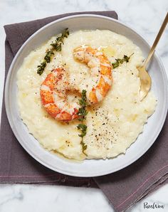 shrimp and grits served in a bowl with a spoon