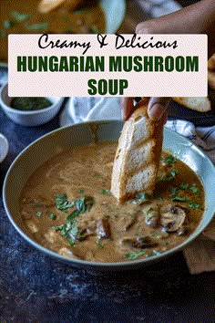 a hand dipping bread into a bowl of creamy and delicious hungarian mushroom soup