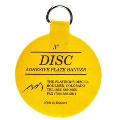 a yellow disc shaped keychain with the words disc on it