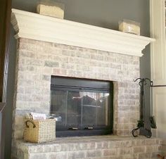 a white brick fireplace in a living room