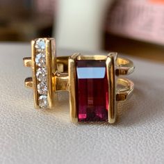 This Is A Beautiful, One Of A Kind, Designer Looking Ring. It's Crafted In 14k Yellow Gold, I Could Not Find A Stamp, But Was Tested To Guarantee . The Stone Is Pinkish Red With Some Purplish Hues In It, My Jeweler Said Possibly Its Rhodolite Garnet Or Pink Tourmaline,As They Are From The Same Family Of Stones? Unfortunately, I Do Not Know For Sure What This Stone Actually Is, But Its Stunning Color Either Way !!! The Diamonds Sparkly White And Genuine. The Ring Sits Sort Of Between Size 5.5 And Formal Fine Jewelry Tourmaline Birthstone Ring, Tourmaline Birthstone Ring, Fine Jewelry For Formal Events, Tourmaline Birthstone Ring For Formal Occasions, Garnet And Diamond Ring, Pinkish Red, Diamonds Ring, Rhodolite Garnet, Garnet Rings, Vintage Designer