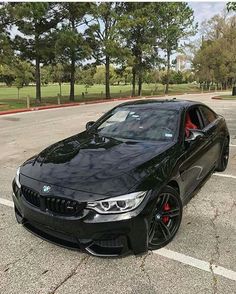 a black car parked in a parking lot