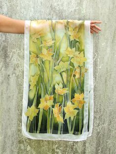 Daffodils scarf is a ready to go hand painted silk scarf decorated with yellow flowers - narcissus on a green background. This green spring scarf symbolizes joyful time of April and May. This green scarf is ready for shipping! It is painted on a lovely natural silk Habotai Light, ideal for warm spring time! Habotai Light is very delicate, semi transparent and a bit glossy. The color set for Daffodils scarf was inspired by Art Nouveau and Japanese Kimono art, rich and warm green - yellow colors b Artistic Yellow Silk Scarf For Spring, Yellow Artistic Silk Scarf For Spring, Narcissus Flowers, Scarf Painting, Silk Painting Techniques, Hand Painted Purses, Silk Scarfs, Spring Scarf, Narcissus Flower