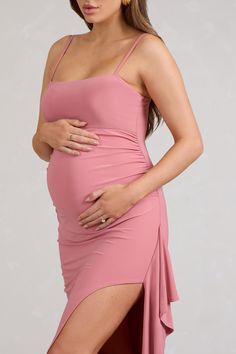 Made to comfortably contour your new curves. Cut Stem is the maternity dress to celebrate you and your plus one in the fresh season ahead. This blush pink maxi dress is crafted from our signature stretch jersey in a strappy silhouette with a ruffle-trimmed skirt split. Style this dreamy dress with simple gold hoops for a timeless baby shower look.Features- Premium stretch jersey- Straight neckline- Adjustable cami straps- Invisible zip closure- Split hemline- Ruffle trim- Maxi lengthSizing & Fit Maternity Maxi Dress With Ruched Detail, Pink Stretch Maternity Dress For Spring, Ruched Maxi Maternity Dress, Fitted Pink Maternity Dress In Feminine Style, Feminine Fitted Pink Maternity Dress, Pink Fitted Maternity Dress, Fitted Pink Feminine Maternity Dress, Pink Nursing Friendly Maternity Dress For Spring, Pink Nursing-friendly Maternity Dress For Spring