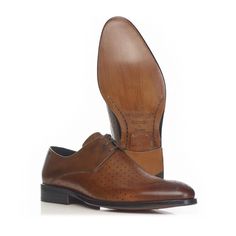 A sophisticated 3-hole derby with a unique perforated upper featuring the Mariano logo engraving.  Fine calf leather Handmade leather sole Option: Anti Slip Sole Material: Leather  Care intructions: Take good care of your shoes and they should do you proud for many years. Shoes should be put on using a shoe horn. Avoid wearing the same shoes on consecutive days since the moisture absorbed by the leather takes at least 24 hours to dry out. For storage, insert a shoe tree to avoid deformation of t Business Oxfords With Perforated Plain Toe, Business Oxfords With Perforated Toe Box, Luxury Business Oxfords With Perforated Toe Box, Formal Dress Shoes With Perforated Toe, Business Dress Shoes With Perforated Cap Toe, Luxury Business Dress Shoes With Perforated Toe Box, Business Leather Lace-up Shoes With Perforations, Brown Oxfords With Perforated Toe For Business Casual, Cognac Wingtip Dress Shoes For Derby