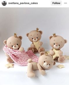 three teddy bears with crowns sitting next to each other