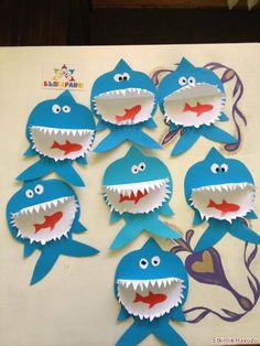 paper cut out of sharks with teeth and eyes