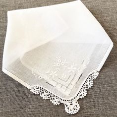 This fine vintage handkerchief is made from fine white linen and has a white work floral and lace corner with drawn threadwork. It would make a wonderful bridal handkerchief, a bridesmaid gift, a gift for a loved one, or simply kept for its own vintage charm. Handkerchiefs also look lovely when repurposed, such as to wrap a small gift or used to wrap the stems of a bouquet of flowers. This hankie measures 26.5cm x 26.5cm / 10.5" x 10.5". It is in good condition for its age and has been freshly l Elegant White Handkerchiefs With Floral Embroidery, Elegant White Floral Embroidered Handkerchiefs, Elegant White Handkerchiefs With Machine Embroidery, Classic White Lace Handkerchiefs, Elegant White Handkerchiefs With Lace Work, Classic White Lace Handkerchief, Classic White Lace Work Handkerchiefs, Elegant White Handkerchiefs With Crochet Lace, White Lace Handkerchiefs With Embroidery