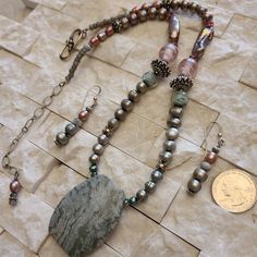 "Mossy Green" Jasper Pendant: Approx 1-3/4" Long, Crystal In 2 Sizes & Shapes, Fresh Water Pearls In 6 Sizes & Shapes, Bali Silver Is 4 Sizes & Shapes, Glass Beads. Approx 21" Long Finished With A Bali Silver "S" Hook, 3-1/2" Extender & Dangle. Earrings Approx 2" Long With Sterling Silver Hook With Bead, 3 Pearls, Glass Bead And 2 Silverstone Spacers. Soothing! Mossy Green, Bali Silver, Green Jasper, S Hook, Fresh Water Pearls, Jasper Pendant, Water Pearls, Glass Bead, Womens Jewelry Necklace