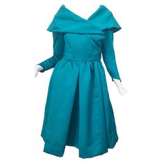 Beautiful vintage VICTOR COSTA teal green / blue satin fit n' flare long sleeve cocktail dress! Features an elegant collar with a fitted bodice and tulip shaped sleeve cuff that has hidden snaps. Wrap style with several hidden snaps and hook-and-eye closures at waist and bust. Attached crinoline in the same teal color adds fullness to the skirt. The perfect cocktail dress! In great condition. Made in USA Approximately Size US 6 / 8 Measurements: 34-36 inch bust 27-28 inch waist Free hips 39 inch Long Blue Maxi Dress, Victor Costa Dress, Victor Costa, Perfect Cocktail Dress, Long Sleeve Cocktail Dress, Cocktail Dress Vintage, Flare Long Sleeve, Satin Long Sleeve, Full Circle Skirts