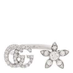 This is an authentic GUCCI 18K White Gold Diamond Flora GG Open Ring size 51 5.75. The ring is crafted of 18 karat white gold and features an open ring with the double G logo motif and a floral motif pave-set with round brilliant cut diamonds, approximately .55 total carat weight. Double G Logo, G Logo, Gucci Jewelry, Open Ring, Round Brilliant Cut Diamond, Brilliant Cut Diamond, White Gold Rings, White Gold Diamonds, Floral Motif