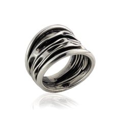 Sculpted in Mexican sterling silver and designed as a piece of architecture for the hand, this oh-so-chic crinkled ring is a harmonious mix of shapes, forms, and lines. Paired with the matching bracelet and hoop earrings it will finish off any outfit in style. Designer’s tip: spruce up all your casual day ensembles with this versatile ring inspired by organic shapes. 925 Sterling silver Oxidized finish Handmade in Taxco, Mexico Wide Band Ring, Wide Band Rings, Matching Bracelets, Oxidized Sterling Silver, Wide Bands, Organic Shapes, Band Ring, Band Rings, Sterling Silver Rings