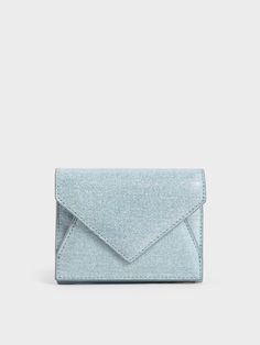 Equal parts practical and polished, this Bosie wallet in vinyl denim is classic-with-an-edge. Featuring clean-cut lines and a distinctive envelope design, this wallet will appeal to those with a penchant for minimalist styles. Along with its compact silhouette, this lightweight wallet can easily be held in the palm of your hand and will slot right into a slim side pocket. The vinyl denim finish also ensures that you wallet is well-protected from spills and stains. Envelope Wallet, Metallic Heels, Envelope Design, Classic Pumps, Charles Keith, Palm Of Your Hand, Clean Cut, The Palm, Ankle Straps