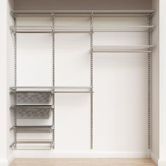 an empty walk in closet with shelves and bins