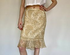 "Product Details: Silk beige midi skirt with ruffling at the bottom of skirt. Super comfortable, breathable and lightweight! Gorgeous for a special occasion or a lunch outfit with friends. Has zipper. Brand: Banana Republic Material: 100% Silk Marked Size: 2 Measurements: Waist: 14\" Length: 27.5\" Hip: 19\" Hem: 22.5\" Perfect condition. Model: 5'9\" All sales are final." Fitted Gold Skirt For Spring, Fitted Gold Skirt For Summer, Gold Midi Skirt For Summer, Gold Fitted Skirt For Summer, Y2k Denim Skirt, Beige Midi Skirt, Beige Pencil Skirt, Lunch Outfit, Silk Midi Skirt