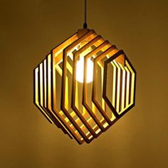 a wooden light fixture hanging from a ceiling