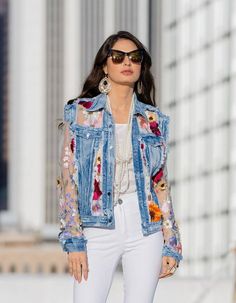 Welcome the warmth of spring and summer with our enchanting denim jacket, beautifully adorned with vibrant floral embroidery on sheer sleeves. This unique piece combines the casual cool of distressed denim with the feminine charm of colorful blooms, making it an ideal statement garment for the season. The jacket features classic denim elements like flap chest pockets and a button-front closure, enhanced with raw, frayed edges for an edgy touch. The sleeves are a sheer delight, showcasing a lush Clothes Embroidery, Sewing Alterations, Embroidery Diy, Diy Jacket, Altered Couture, Party Inspo, Embellished Denim, Lace Jacket, Denim And Lace