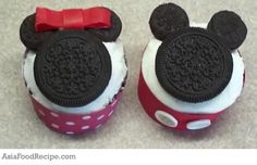 two mickey mouse cupcakes are decorated with oreo cookies and red bow ties