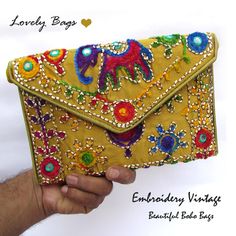 Golden Shoulder Bags - Girls Shoulder Bags Paisley Beautiful Woman Golden Bags Stylist Handbags Embroidery Gold Bags Purse Hand Clutch Traditional Bags Girls. An elegant and aesthetically handcrafted golden clutch bag for gorgeous ladies which can be used in any occasion, from a ravishing night party to a traditional wedding or just for daily purpose.  Product Dimensions Or Size: ♥ Width → 9 inches (22.86 cm) Approx. ♥ Length → 6 inches (15.24 cm) Approx. ♥ Strap Height/drop → 23 inches (58.42 cm)  Approx. ♥ Pattern → Shoulder Bag ♥ Color → Golden It is made by skilled Indian craftsmen with beautiful embroidery gold color bag and right velvet touch. The embroidered elephant is a symbol of peace, wisdom and grandeur. We Have made successful series of Bags for Regular, Casual and Formal uses Trendy Embroidered Pouch Shoulder Bag, Trendy Embroidered Shoulder Bag As Gift, Yellow Embroidered Travel Bag, Trendy Embroidered Pouch Bag, Rectangular Bags With Multicolor Embroidery As Gifts, Yellow Embroidered Bag For Daily Use, Rectangular Travel Bag With Handwork, Rectangular Handwork Bags For Travel, Everyday Clutch Bag For Festivals