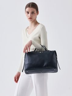 Editor's NoteThe elegant and classic bag from SUHADO is designed to match any look according to your mood.- Boston Tote Shoulder Bag- Unique design- Classic and casual mood- Daily bag- Adjustable strapMeasurements(inch)- Width: 14.96 in.- Height: 9.45 in.- Depth: 5.51 in.- Strap: 47.24 in. - 53.15 in.Composition & Care- 100% Cow Leather- Lightly clean the contaminated area with a soft clothDesigner- by SUHADO Staud Tote Shoulder Bag With Top Carry Handle, High-end Tote Satchel With Handle Drop, Nylon Shoulder Bag With Top Carry Handle For On-the-go, Gunmetal Hardware Tote Shoulder Bag For On-the-go, Daily Bag, Classic Bags, Cow Leather, Unique Designs, Navy