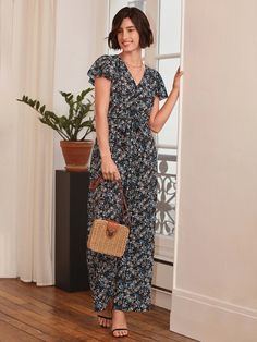 Achieve a timelessly chic look with this Floral Print Belted Wide Leg Jumpsuit. Decorated with a beautiful floral print all over in a black shade, this sophisticated one-piece features a comfortable, flowy fit and a fashionable belted waist, perfect for making a stylish statement. Indulge in the luxury of this timelessly elegant and tasteful ensemble today. Specifications: Color: Black Style: Boho Pattern Type: Floral, All Over Print Type: Wide Leg Details: Ruffle, Wrap Length: Long Fit Type: Regular Fit Neckline: V neck Sleeve Length: Cap Sleeve Sleeve Type: Butterfly Sleeve Waist Line: High Waist Fabric: Non-Stretch Material: Woven Fabric Composition: 100% Polyester Care Instructions: Machine wash or professional dry clean Body: Unlined Belt: Yes Sheer: No Size Chart(cm): Size Belt Lengt Casual Floral Print V-neck Jumpsuit, Comfy Jumpsuits, Butterfly Sleeve, Clean Body, Boho Patterns, Butterfly Sleeves, Black Shade, Style Noir, Style Boho