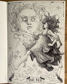 an open book with a drawing of a woman and the sun on it's cover