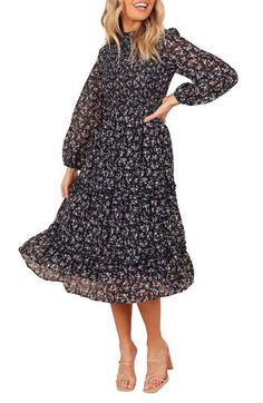 Feel fresh and free in this long-sleeve midi dress patterned in dainty blooms and designed with a smocked bodice and a flowy skirt that has ruffled tiers. Back keyhole with button-and-loop closure Mock neck Long sleeves with elastic cuffs Lined, except sleeves 100% polyester Hand wash, dry flat Imported Long Sleeve Modest Dresses, Long Sleeve Fall Dress, Fall Midi Dress, Knee Length Floral Dress, Midi Dress Pattern, Christy Dawn Dress, Long Fall Dresses, Long Sleeve Dresses Fall, Midi Dress Fall