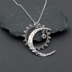 "Sterling silver Celestial Sun, Moon, and Star necklace accented with a Swarovski Crystal of your color choice. All pieces dangle independently of each other. The moon symbolizes the rhythm of time and its phases symbolize eternity and enlightenment. - Chain Style: Oxidized Cable or Shiny Rolo - Chain Length: 16\", 18\", 20\", 22\", 24\" - Moon Pendant 1 3/8\" tall - All jewelry parts are 925 solid sterling silver - Swarovski Crystals: See the Image chart for crystal colors OXIDIZED CHAIN Option Bohemian Sterling Silver Jewelry For Mother's Day, Spiritual Silver Half Moon Jewelry, Spiritual Silver Moon Charm Necklace, Silver Celestial Metal Necklace, Silver Moon Charm Necklace With Sun And Moon Design, Silver Moon Necklace With Sun And Moon Design, Symbolic Silver Necklace With Moon Phase, Celestial Silver Half Moon Jewelry, Symbolic Silver Moon Phase Necklace