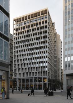 two tall buildings with balconies in the middle